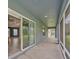 Spacious screened-in patio with a view of the manicured backyard and landscaping at 12037 Conway St, Spring Hill, FL 34609