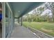 Large screened-in patio offers a relaxing view of the green backyard at 12037 Conway St, Spring Hill, FL 34609