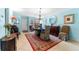 Well-appointed dining room with a round table, elegant chandelier, and a decorative rug at 1205 Hounds Run, Safety Harbor, FL 34695