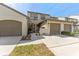 Charming townhome featuring a private entrance, garage, and well-maintained landscaping at 1205 Hounds Run, Safety Harbor, FL 34695