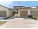 Charming townhome featuring a two-car garage, well-maintained landscaping, and a welcoming curb appeal at 1205 Hounds Run, Safety Harbor, FL 34695