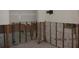Basement area with open walls showing the studs, wiring, and pipes at 125 11Th Ave, Indian Rocks Beach, FL 33785