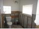 Bathroom featuring a toilet and window, undergoing renovations at 125 11Th Ave, Indian Rocks Beach, FL 33785