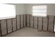 Bedroom with two windows and exposed studs ready for remodeling at 125 11Th Ave, Indian Rocks Beach, FL 33785