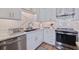 Modern kitchen features stainless steel appliances, stylish cabinets, and elegant countertops at 125 11Th Ave, Indian Rocks Beach, FL 33785