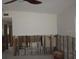 Living room with exposed studs with an opening to another room at 125 11Th Ave, Indian Rocks Beach, FL 33785