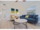 Comfortable living room featuring modern furniture and plenty of natural light from a nearby window at 125 11Th Ave, Indian Rocks Beach, FL 33785