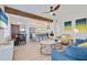 Spacious living room with a modern open floor plan that integrates a dining area and gourmet kitchen at 125 11Th Ave, Indian Rocks Beach, FL 33785