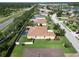 Aerial view of backyard featuring a private pool, lush lawn, and an enclosed fence at 12903 49Th E Ln, Parrish, FL 34219