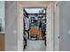 A well-organized walk-in closet featuring shelves, drawers, and hanging space for optimal storage solutions at 12903 49Th E Ln, Parrish, FL 34219