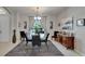 Contemporary dining room with a glass table, modern décor, and a view of the outdoors at 12903 49Th E Ln, Parrish, FL 34219