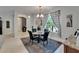 Elegant dining area with a modern chandelier and arched doorway at 12903 49Th E Ln, Parrish, FL 34219