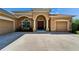 Beautiful home featuring a three car garage, mature landscaping, and barrel tile roof at 12903 49Th E Ln, Parrish, FL 34219
