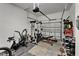 Well-lit garage converted to home gym, offering an efficient fitness space at 12903 49Th E Ln, Parrish, FL 34219