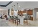 Kitchen bar with seating and pendant lights overlooking the living area at 12903 49Th E Ln, Parrish, FL 34219