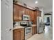 Modern kitchen with stainless steel appliances and granite countertops at 12903 49Th E Ln, Parrish, FL 34219