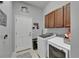 Convenient laundry room with washer and dryer, plus storage at 12903 49Th E Ln, Parrish, FL 34219