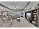 Comfortable living room with neutral color palette and built-in shelving at 12903 49Th E Ln, Parrish, FL 34219