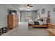 Spacious main bedroom with a ceiling fan, natural light, and a wooden dresser at 12903 49Th E Ln, Parrish, FL 34219