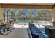 A screened-in lanai offers outdoor living space and lounge seating overlooking a sparkling private pool at 12903 49Th E Ln, Parrish, FL 34219