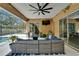 Covered patio with outdoor seating and a view of the backyard pool at 12903 49Th E Ln, Parrish, FL 34219