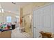 Bright bathroom featuring a glass enclosed shower with neutral toned walls and decorative wallpaper at 13750 Dowling Ln, Odessa, FL 33556