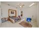 Spacious bedroom with ceiling fan, carpeted floor, and natural light at 13750 Dowling Ln, Odessa, FL 33556