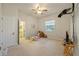 Spacious bedroom with carpeted floors, ceiling fan and connecting bathroom at 13750 Dowling Ln, Odessa, FL 33556
