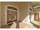 Front entrance featuring decorative double doors and tile flooring at 13750 Dowling Ln, Odessa, FL 33556