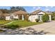 Charming single story home with manicured lawn and elegant architectural details at 13750 Dowling Ln, Odessa, FL 33556