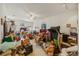 Open living room filled with household items at 13750 Dowling Ln, Odessa, FL 33556