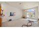 Bright living space with natural light, chandelier, and open layout at 13750 Dowling Ln, Odessa, FL 33556