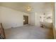 Large screened patio with concrete flooring, ceiling fans, and sliding glass door access to interior at 13750 Dowling Ln, Odessa, FL 33556