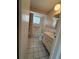 Clean bathroom with a shower/tub and a single-sink vanity with pink countertops at 14264 Page Ave, Largo, FL 33774