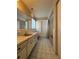 Bathroom featuring a long vanity, a toilet, and a shower/tub combination with tile floors at 14264 Page Ave, Largo, FL 33774