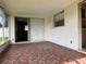 Enclosed patio with tiled flooring and a sliding glass door leading to the interior at 14264 Page Ave, Largo, FL 33774