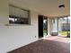 Outdoor patio with decorative pavers, sliding glass door, and views of the yard at 14264 Page Ave, Largo, FL 33774