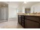 Bathroom with dual sink vanity, granite countertop, shower, and soaking tub at 16302 Vine Cliff Ave, Hudson, FL 34667
