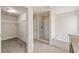 Bright bathroom featuring a walk-in closet, glass shower, and a soaking tub at 16302 Vine Cliff Ave, Hudson, FL 34667