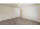 Cozy bedroom features plush carpeting, neutral paint, and a bright airy atmosphere at 16302 Vine Cliff Ave, Hudson, FL 34667