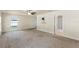 Bright bedroom with an attached bathroom and a glass door leading to the backyard at 16302 Vine Cliff Ave, Hudson, FL 34667