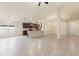 Open floorplan with tiled floors showing the kitchen and dining areas with a view of the backyard at 16302 Vine Cliff Ave, Hudson, FL 34667