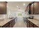 Spacious kitchen with sleek stainless steel appliances, generous counter space, and abundant cabinetry at 16302 Vine Cliff Ave, Hudson, FL 34667