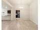 Open living space with view of the kitchen featuring granite countertops and stainless steel appliances at 16302 Vine Cliff Ave, Hudson, FL 34667