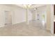 Large open living space featuring tile floors and light neutral walls at 16302 Vine Cliff Ave, Hudson, FL 34667