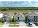 Aerial view of the home showcasing its well-manicured landscaping and serene surroundings at 16934 Oval Rum Dr, Wimauma, FL 33598