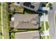 Aerial view of the home showcasing the backyard patio area and neighboring houses at 16934 Oval Rum Dr, Wimauma, FL 33598