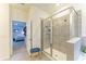 Bathroom featuring a glass shower and doorway to bedroom at 16934 Oval Rum Dr, Wimauma, FL 33598