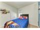Bright bedroom featuring a plush bed, closet, and window at 16934 Oval Rum Dr, Wimauma, FL 33598