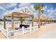 Community cabana features seating, a fan, and shade from the sun at 16934 Oval Rum Dr, Wimauma, FL 33598